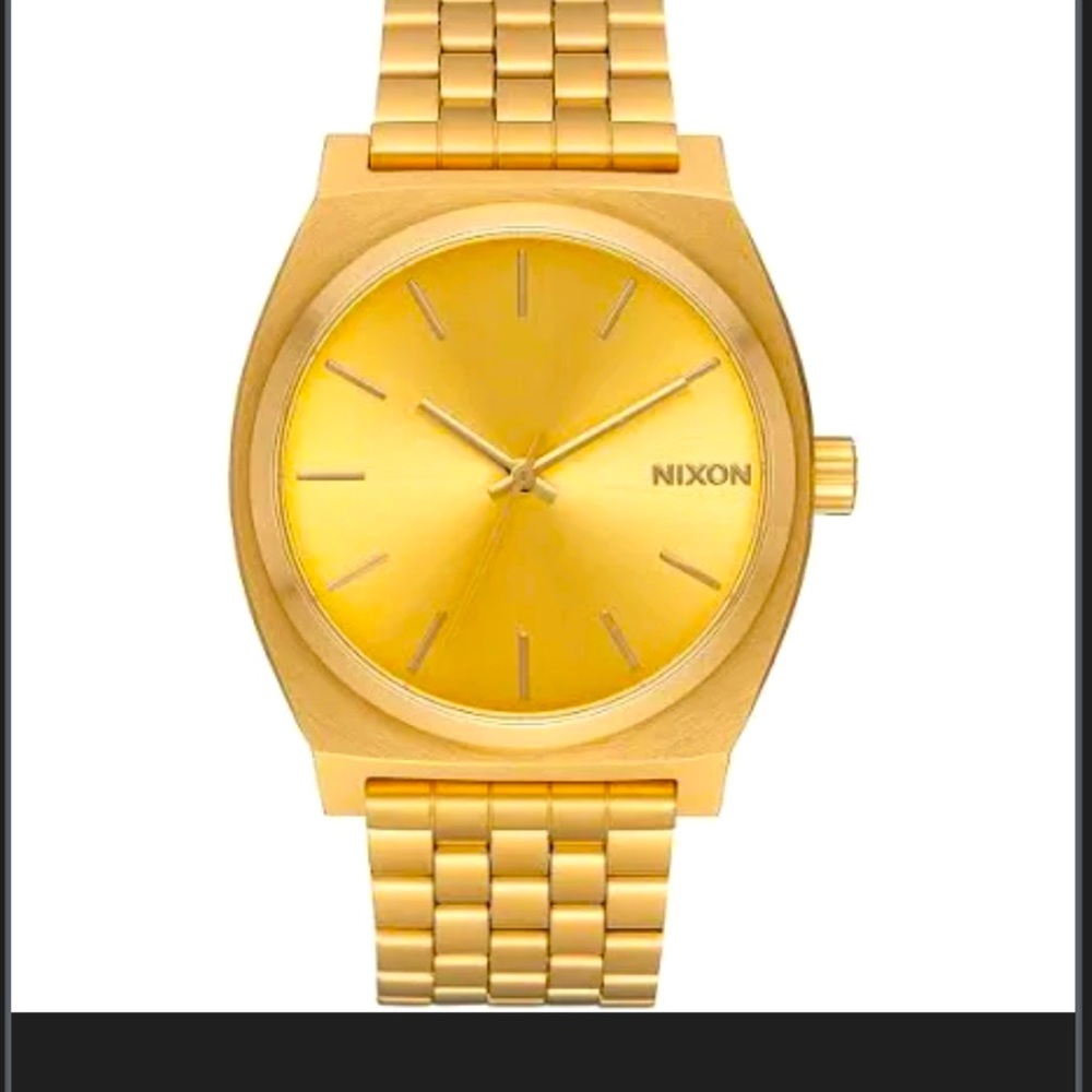 Like new gold Nixon men’s watch.